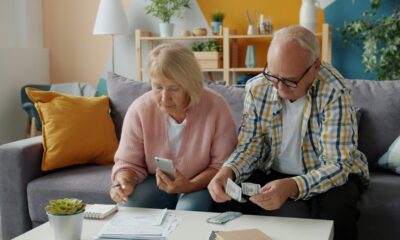 Senior couple reviewing 401k balance and retirement documents