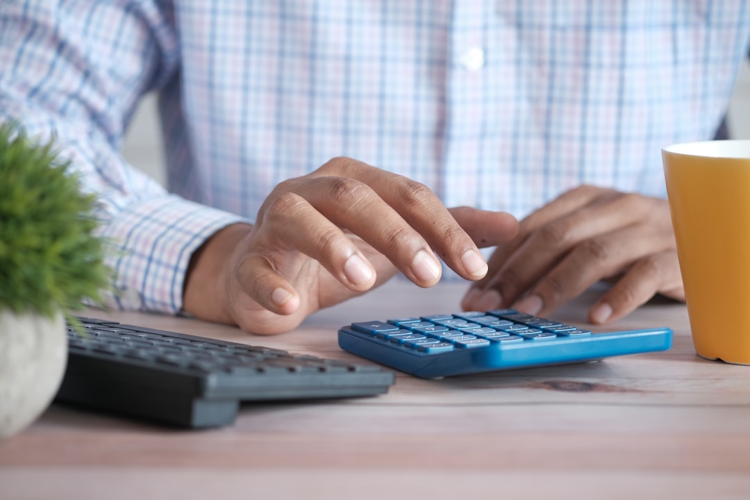 Debt consolidation vs balance transfer comparison shown with calculator and bills