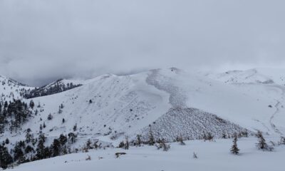 Snow avalanche on mountain representing debt snowball vs debt avalanche methods