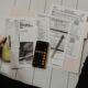 Calculator and paperwork used to work out debt-to-income ratio