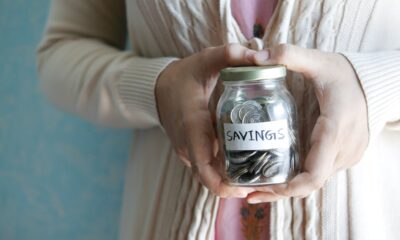 Emergency fund in 2026 savings jar with cash for unexpected expenses