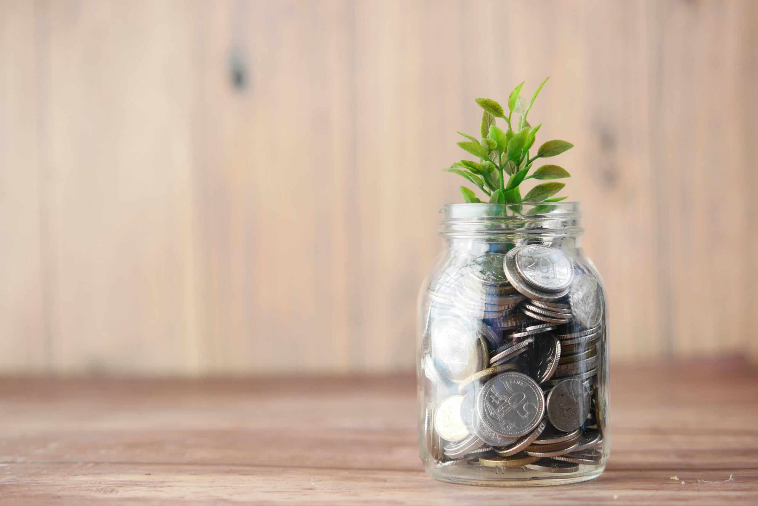 Glass jar of coins representing a high-yield savings account