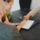 Couple reviewing paperwork on how to pay off your car loan early
