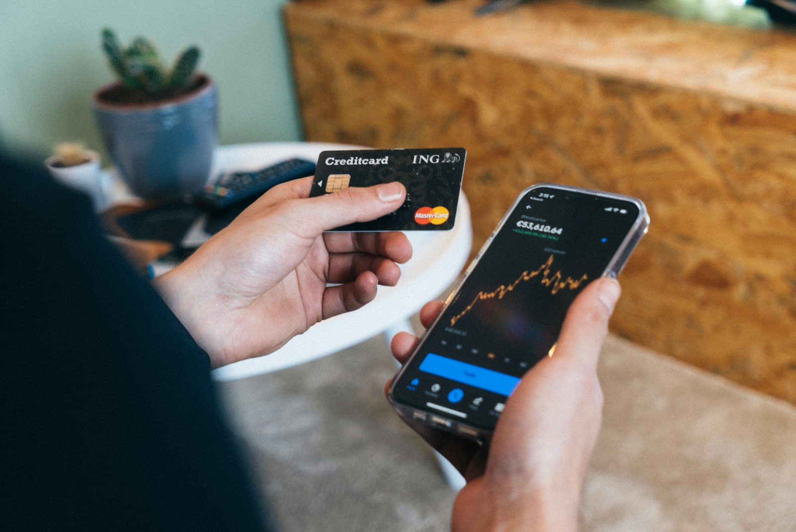 Improve your credit score fast: person checking credit card and score on smartphone