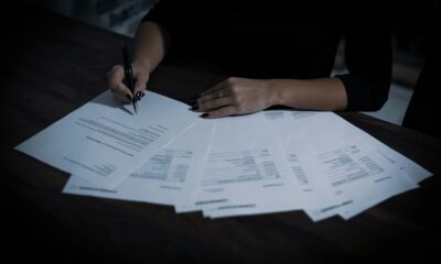 Person signing a medical debt settlement agreement
