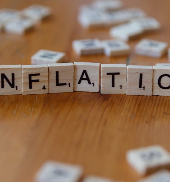 Protect savings from inflation concept with inflation spelled in letters