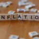 Protect savings from inflation concept with inflation spelled in letters