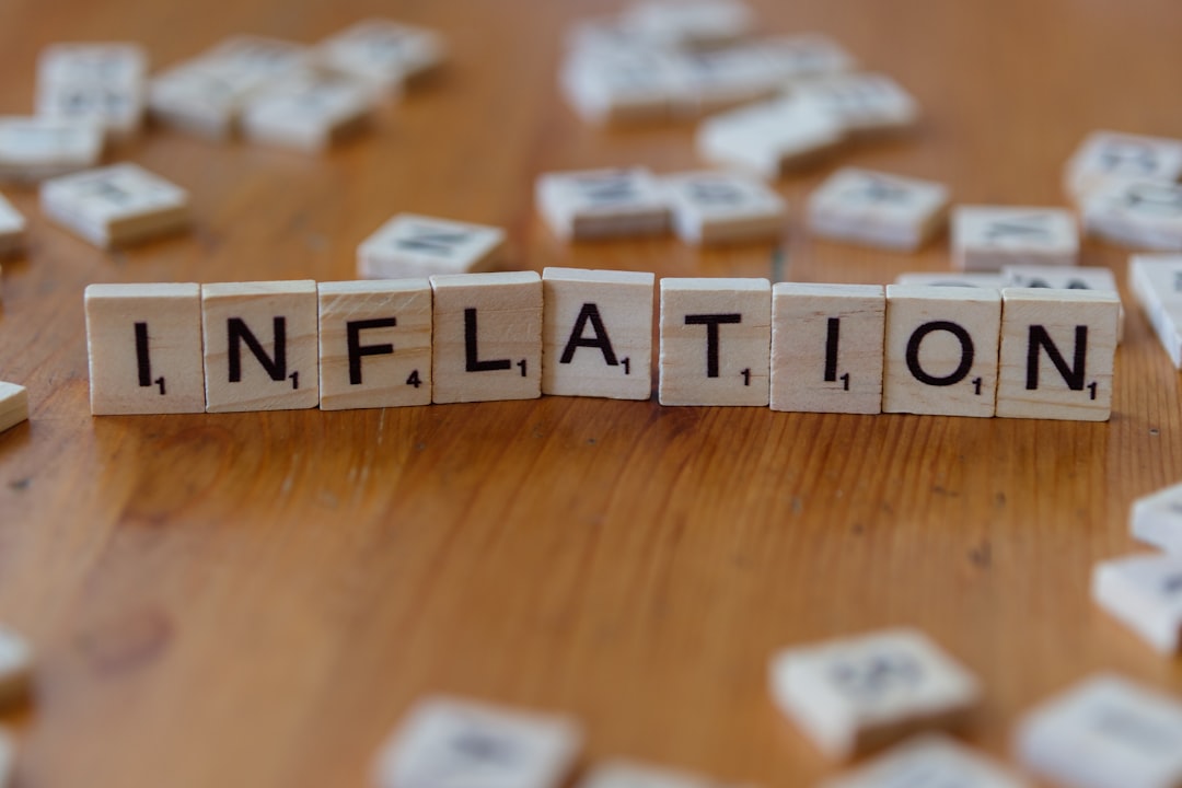 Protect savings from inflation concept with inflation spelled in letters
