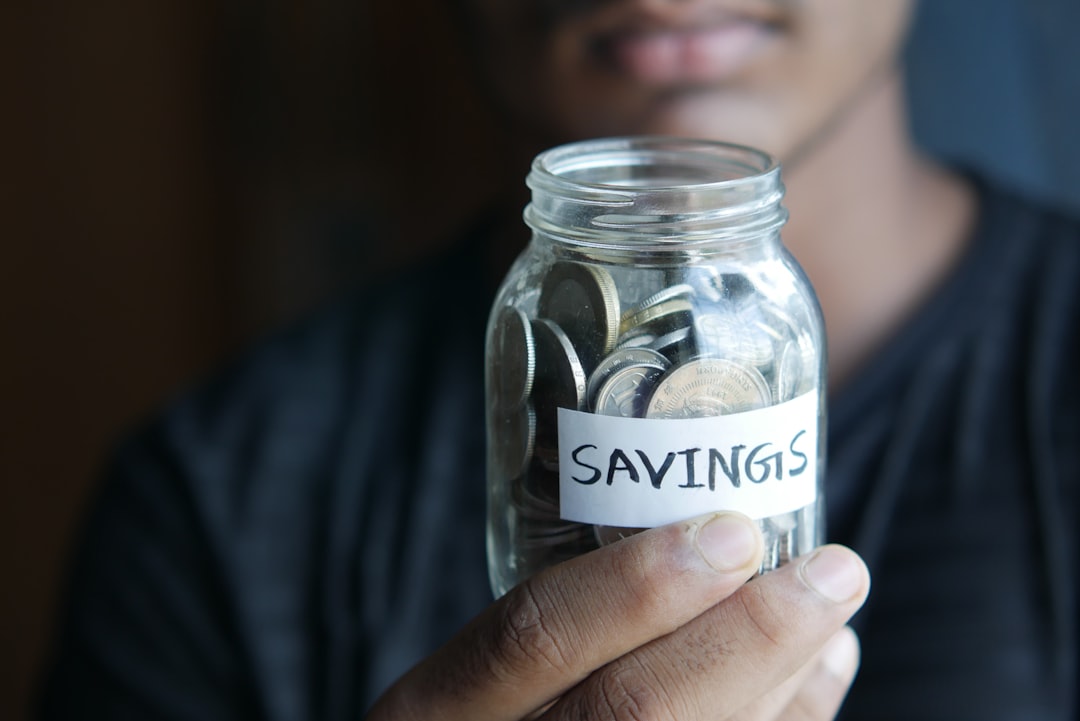 Saving habits jar with coins representing steps toward financial independence