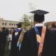 Student loan forgiveness in 2026 graduate celebrating with diploma