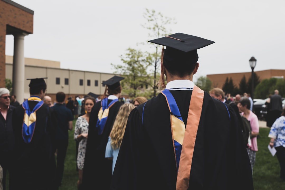 Student loan forgiveness in 2026 graduate celebrating with diploma