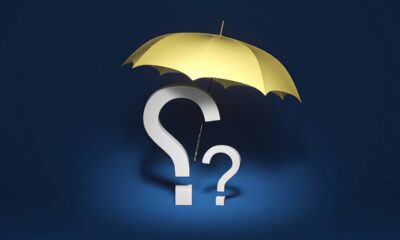 Umbrella with question mark representing the term vs whole life insurance decision