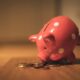 529 plan contribution limits 2026 illustrated with coins going into a piggy bank for college savings