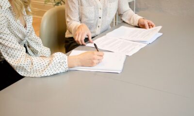 Person reviewing a debt settlement agreement document in 2026