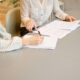 Person reviewing a debt settlement agreement document in 2026