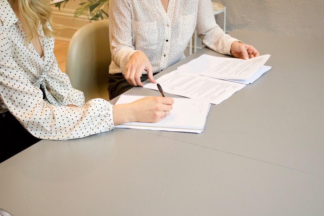 Person reviewing a debt settlement agreement document in 2026