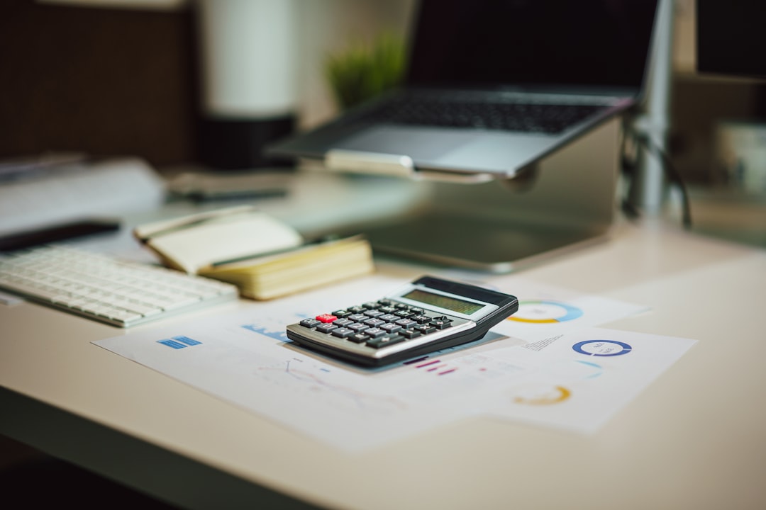 Debt-to-income ratio calculator with a person budgeting monthly debt payments against income